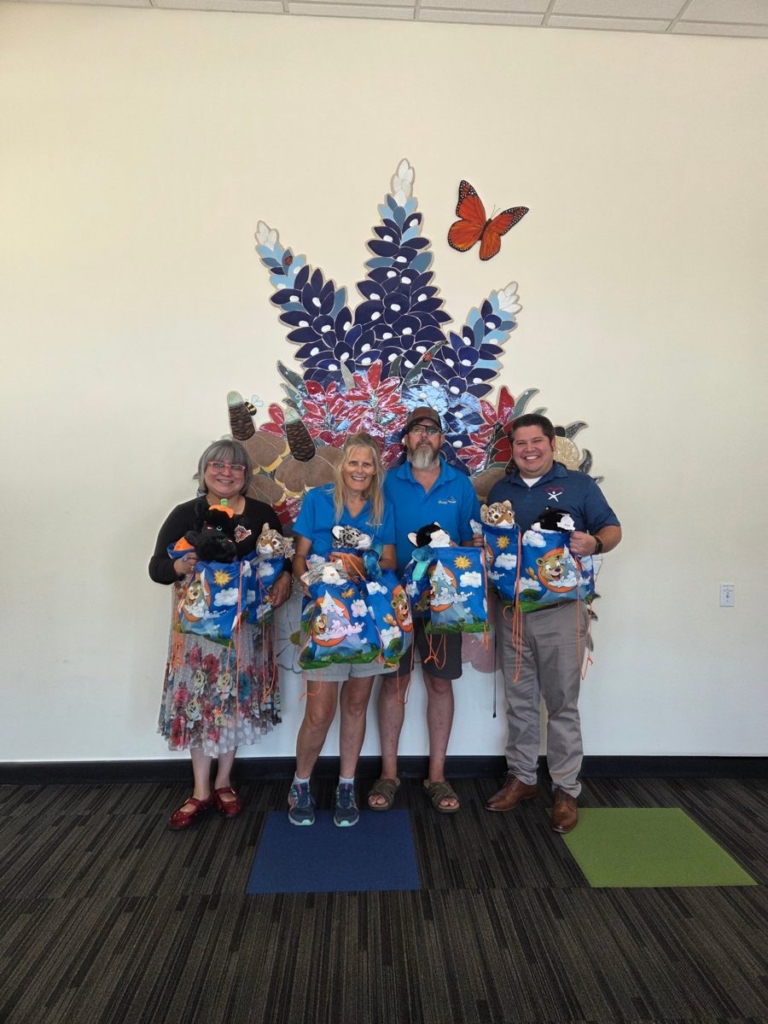 Dennis and Karen of Teddy Bear Mobile delivering ten stuffed animals to Child Advocates San Antonio, Oct 8, 2026