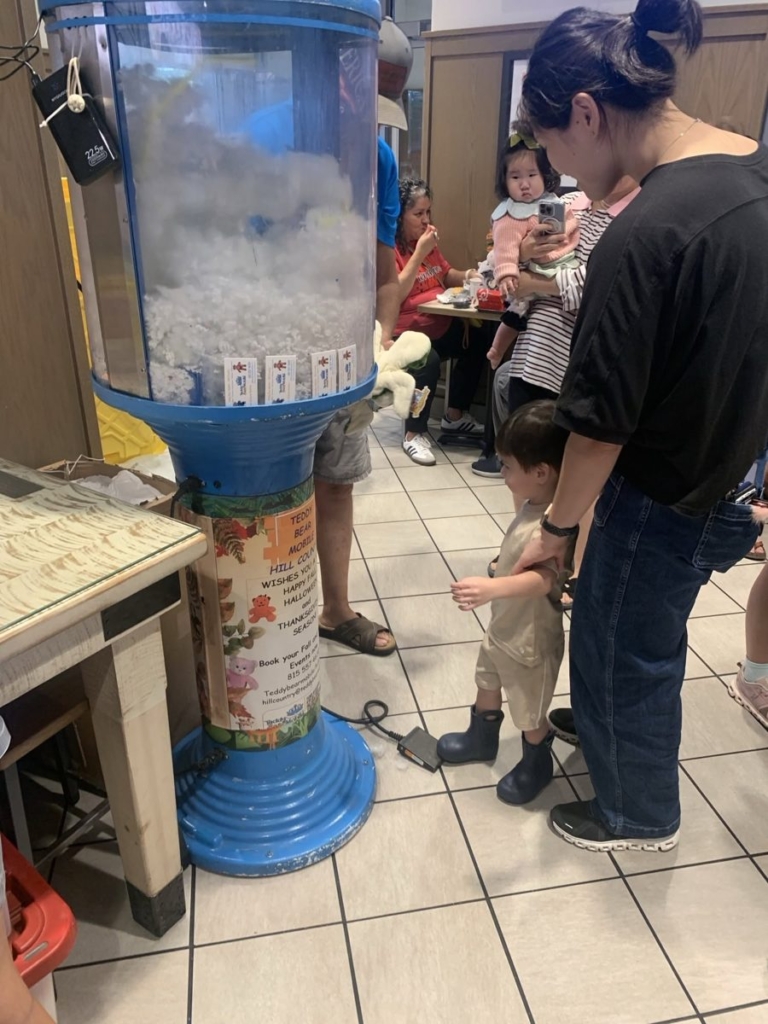 Toddler stuffing an animal at the Teddy Bear Mobile stuffing machine